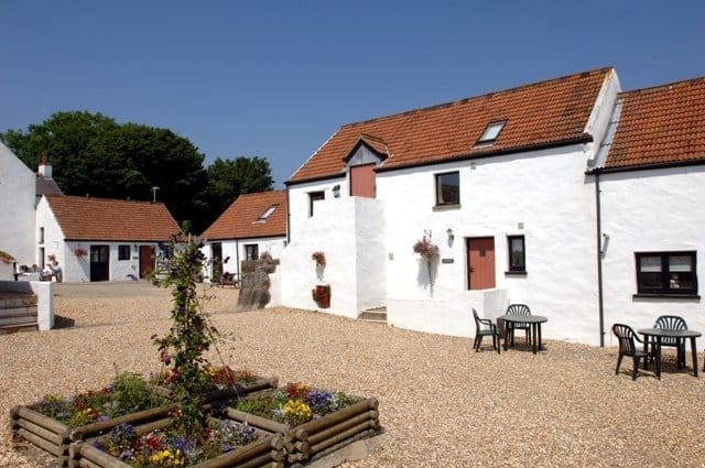 Pretty Pembrokeshire cottages with 12th Century courtyard charm...
